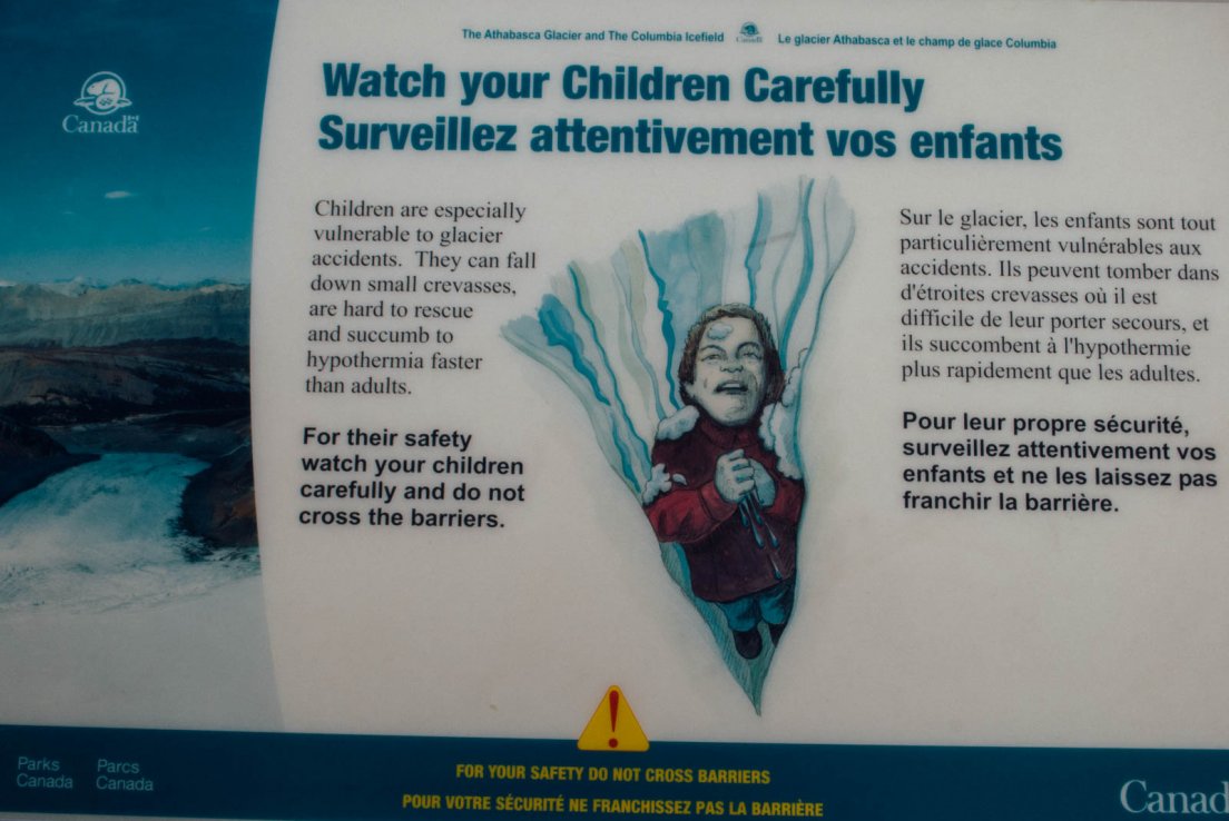 A warning sign in Colombia icefield to the attention of parents that do not wish their kids to be crushed and lost forever in the ice, Icefields parkway between Banff National Park and Jasper National Park #141, 31 july 2016 A warning sign in Colombia icefield to the attention of parents that do not wish their kids to be crushed and lost forever in the ice