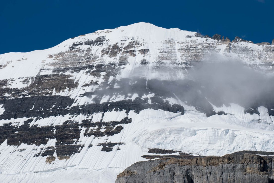 Snow and rock texture upon a cliff on the Three Glaciers Trail