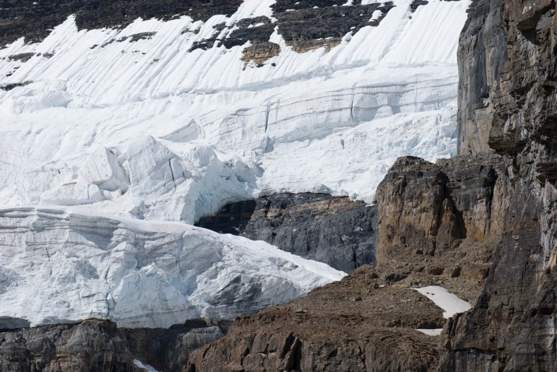 Layers of ice on a cliff on the Three Glaciers Trail