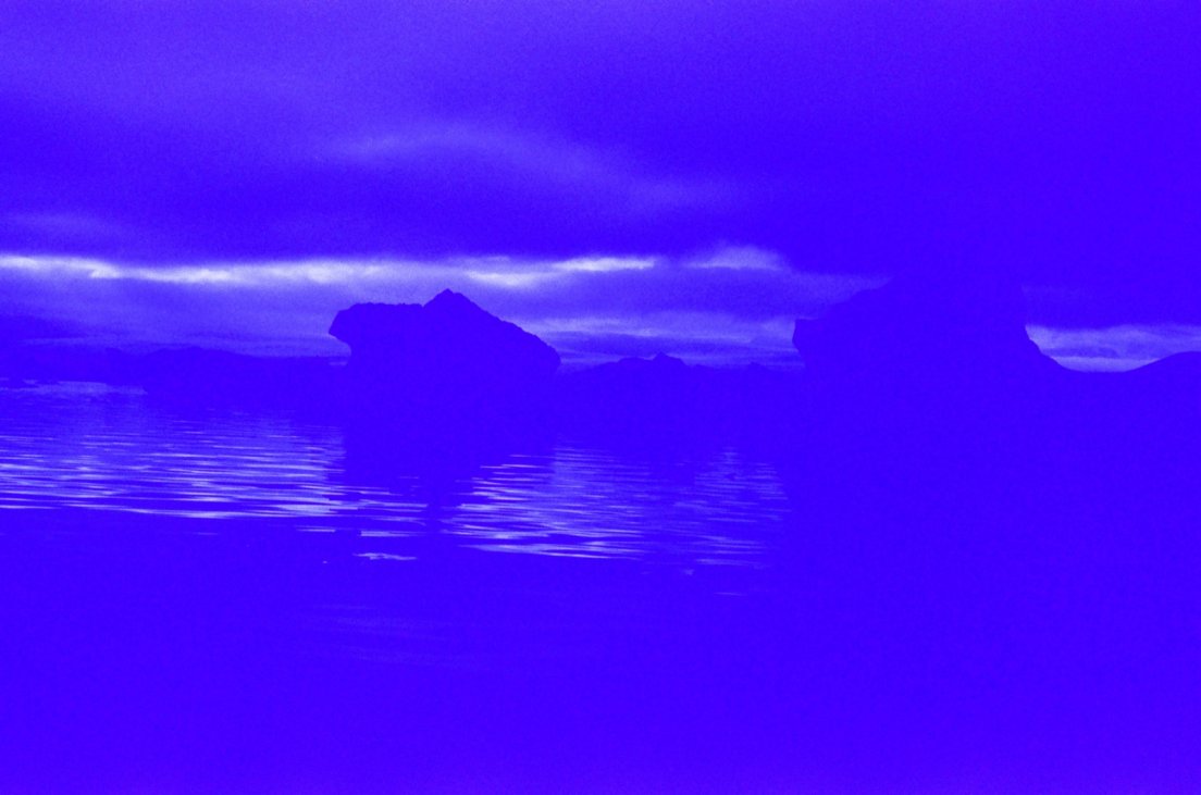 Heavily blue-tinted photograph of icebergs, Jökullsárlón lake, Iceland with Canon AV-1 and Kodak Gold Ultra 400 ISO expired film #018, 1 august 2017 Heavily blue-tinted photograph of icebergs