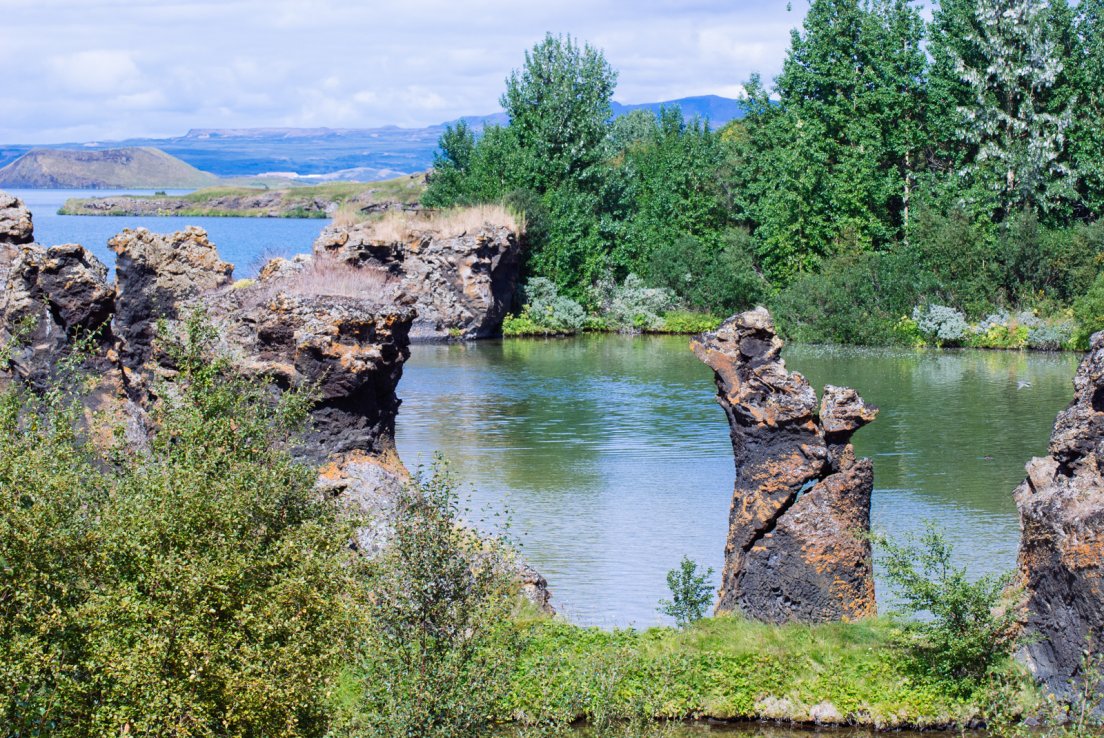 Dimmuborgir in the middle of the lake on a sunny summer day