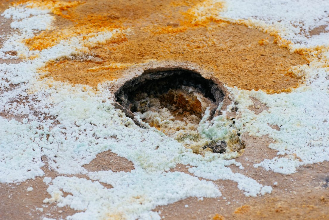 Hole in the crusty texture of the ground in a volcanic area, Námafjall #006, Iceland, 3rd august 2017 Hole in the crusty texture of the ground in a volcanic area