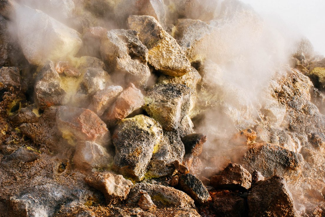 Smoke puffing out of rocks