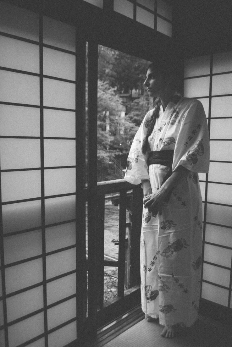 Black and white photograph of a western girl in a yukata watching over a traditional japanese window, Honke Bankyu #017, 16 may 2016 A western girl in a yukata watching over a traditional japanese window