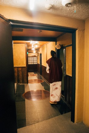 A western girl peaking into a japanese traditional room
