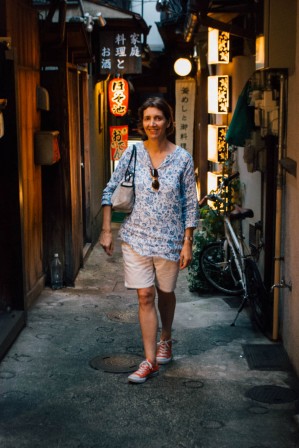 A lady posing in one of the narrow streets of the cho