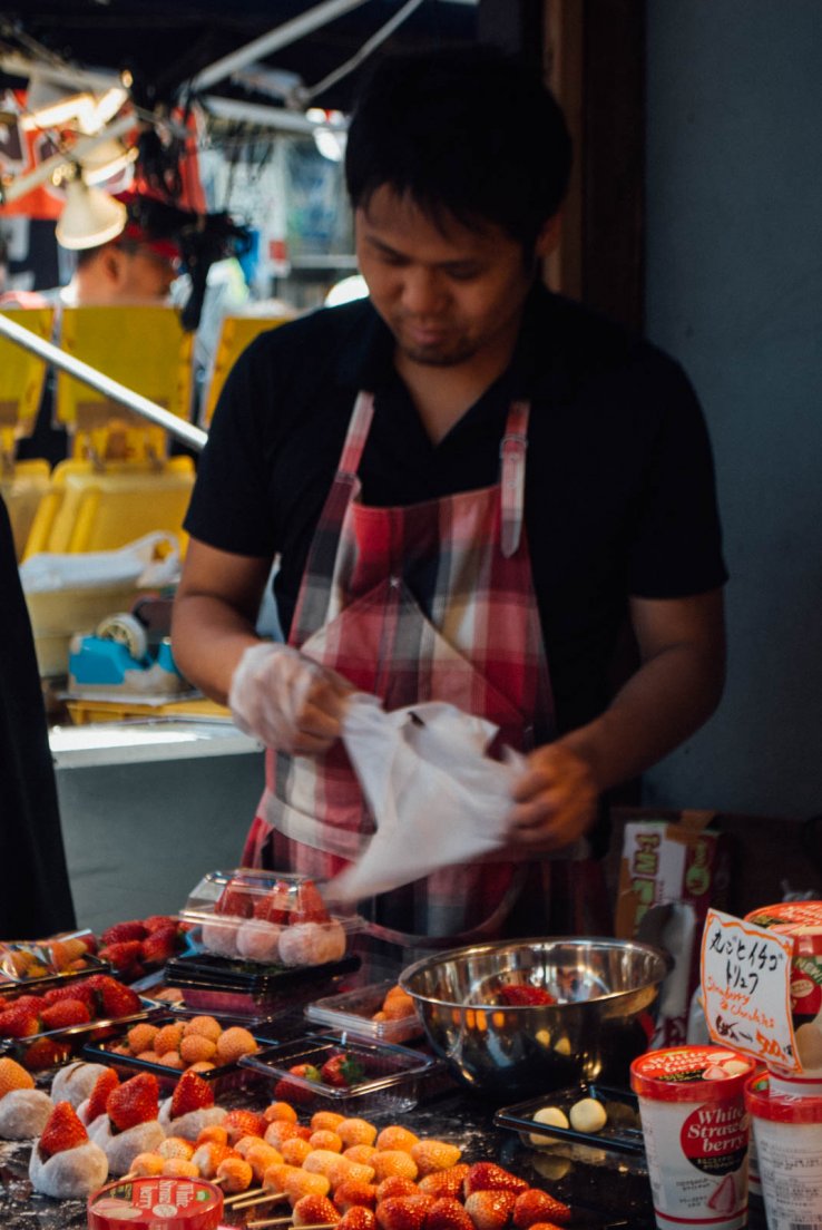 A vendor at a strawberry daifuku stall