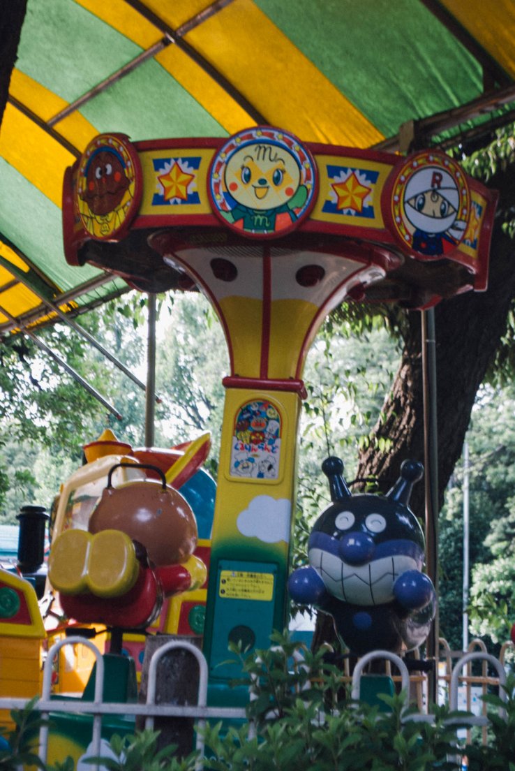 A carousel with japanese cartoon-style characters