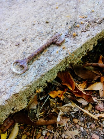 Old rusty key on the floor