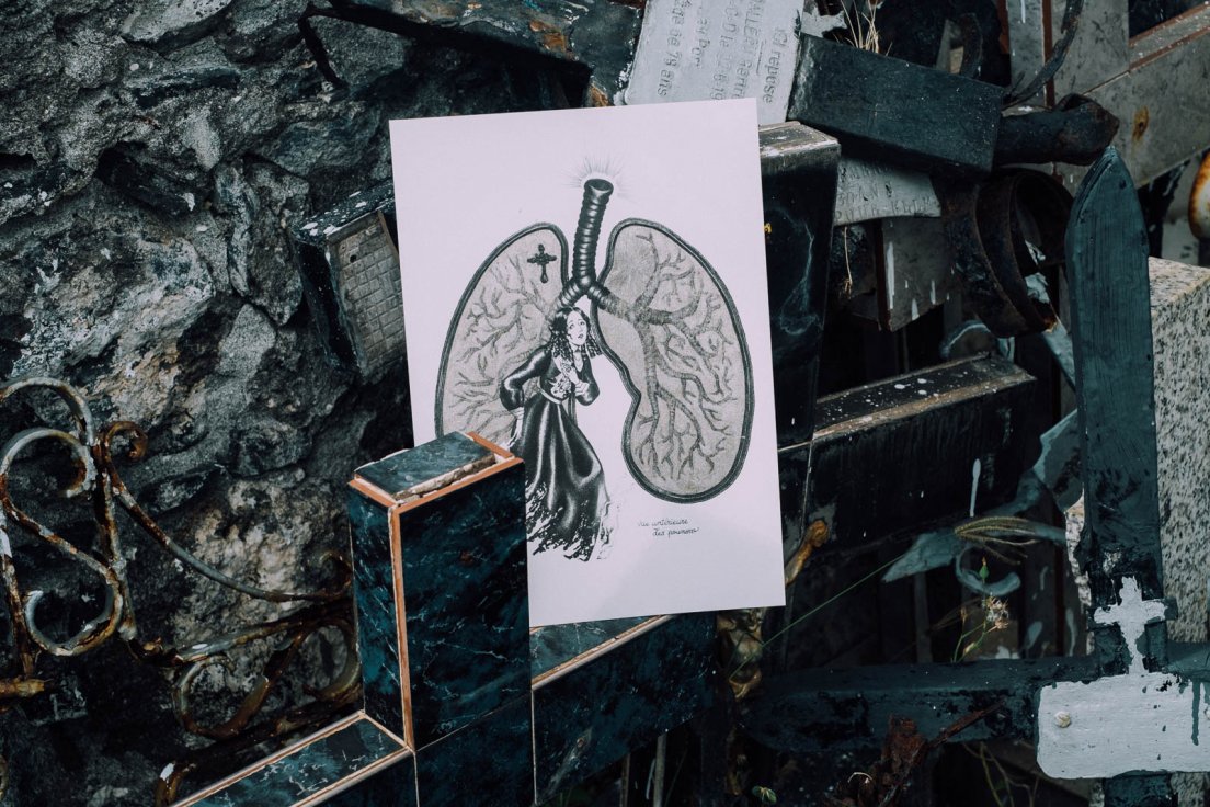 Reproduction print of a gothic illustration on a dump of crosses in a graveyard, Reunion Island